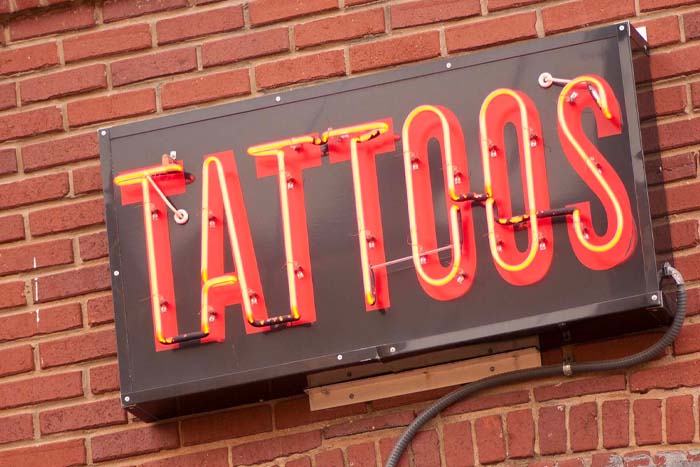 Tattooing and body piercing sign